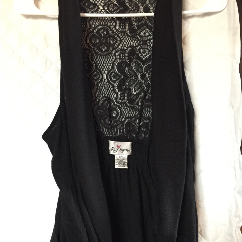 Lightweight vest, lace back, front pockets.